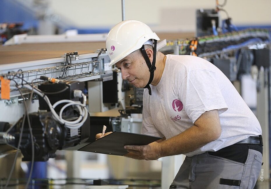 Fives Service specialists during a Preventive Maintenance Inspection (PMI)